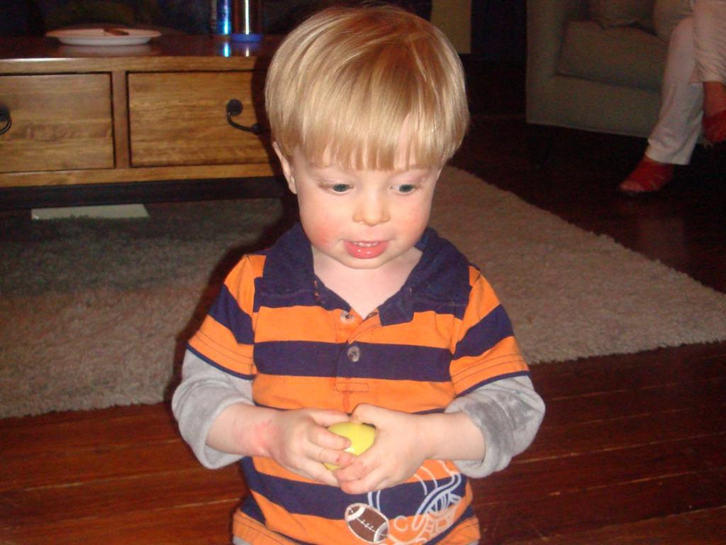 boy holding toy