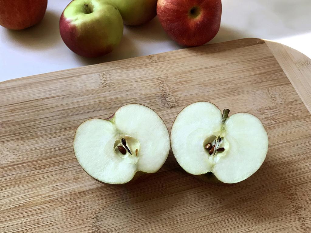 sliced apple on board