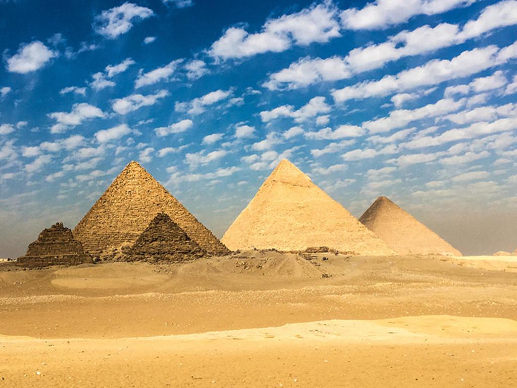 pyramids cloudy sky